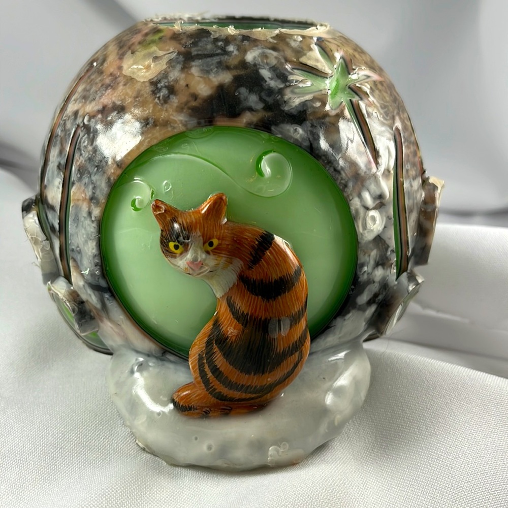Carved candle featuring a calico cat, art piece, glow, votive holder